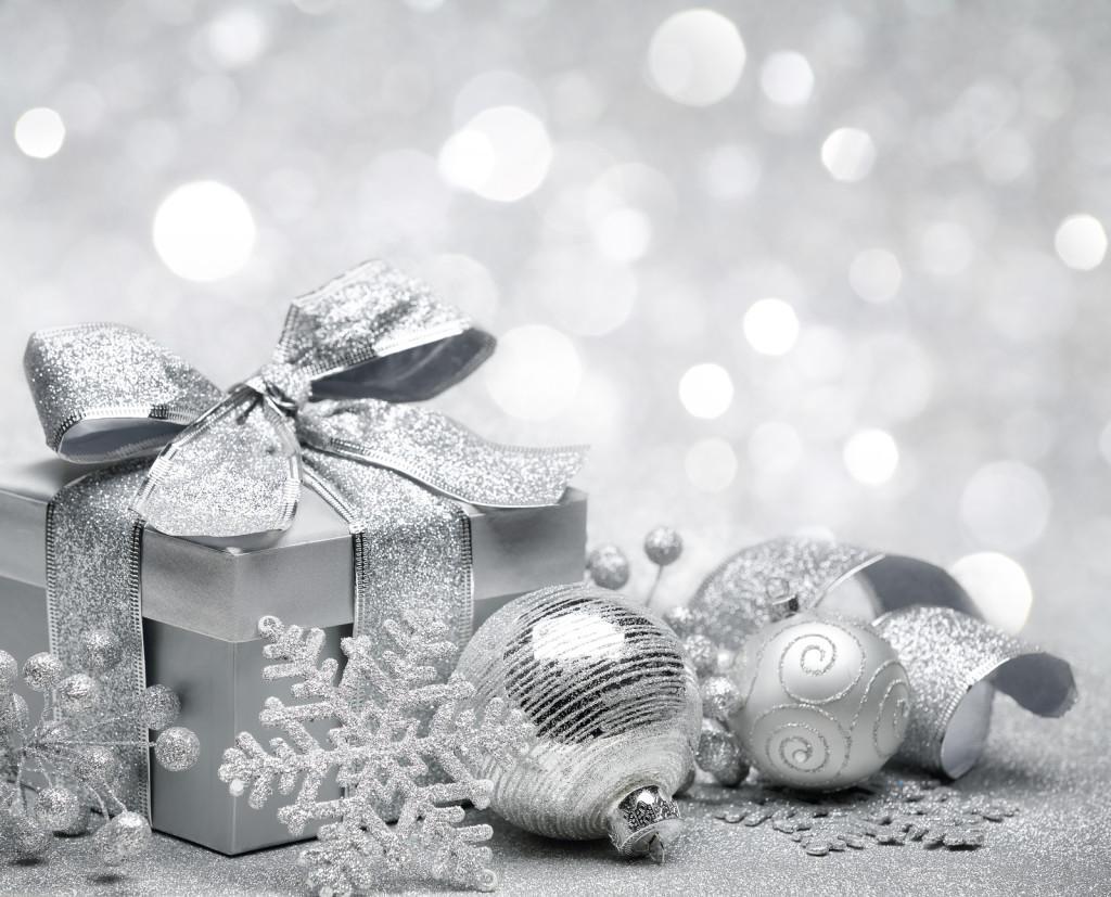 Christmas gift on silver lights background